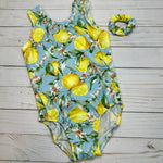 Load image into Gallery viewer, tank gymnastics dance leotard with lemon print on light blue background shown with coordinating olive shorts
