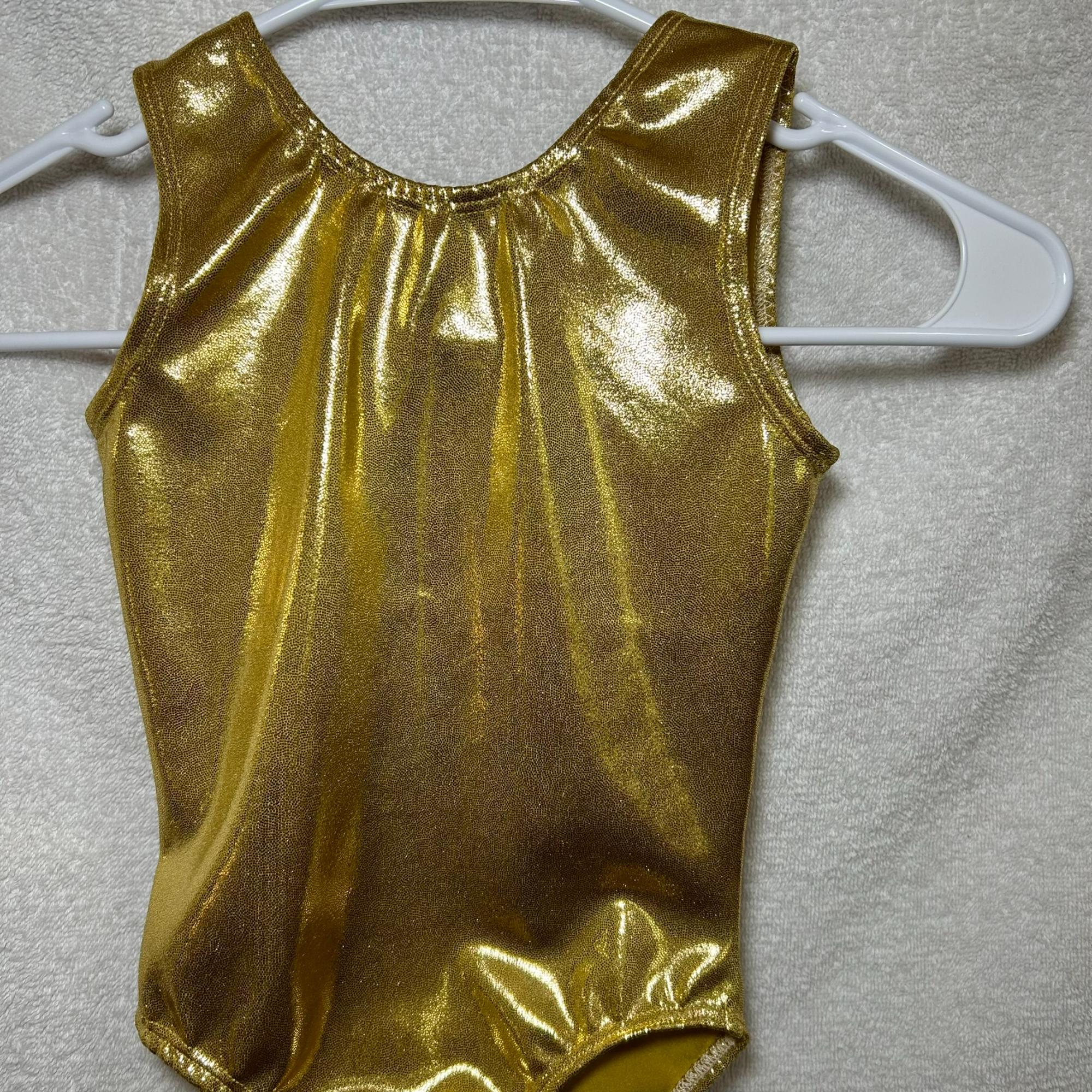 close up of shiny gold leotard