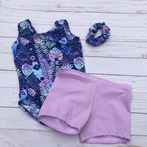 Palm print preschool girls gymnastics dance tank leotard in ombre shades of pink blue and purple on navy background with matching scrunchie and optional coordinating lavender shorts