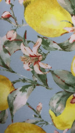 Load and play video in Gallery viewer, tank gymnastics dance leotard with lemon print on light blue background shown with coordinating olive shorts
