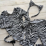 Load image into Gallery viewer, Zebra print, black and white stripe long sleeve leotard with attached tail with black fringe detail at end.  Athletic stretch fabric for second skin fit. Matching zebra print leggings and ear headband shown
