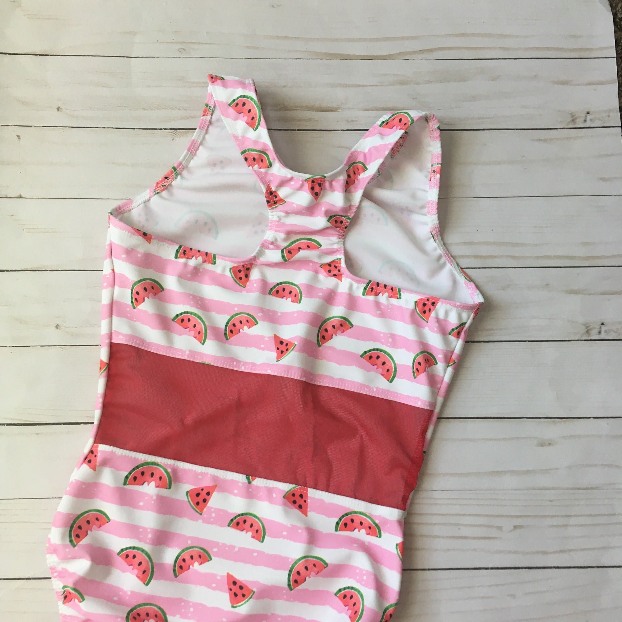 Racerback leotard with red mesh in middle of back